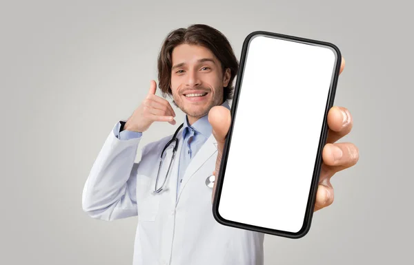 Smiling Medical Worker Showing Blank Smartphone Making Call Gesture Happy — Stok fotoğraf