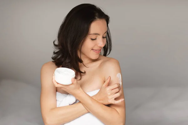 Glad Caucasian Millennial Lady Applying Cream Shoulder Enjoy Good Morning — Foto Stock