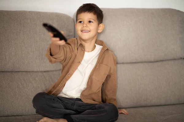 Cheerful Caucasian Little Child Remote Control Switches Channels Set Chooses — Stock Photo, Image