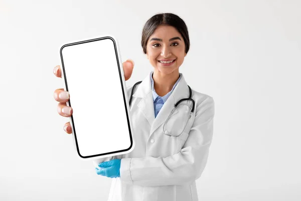 Young Indian Female Doctor Uniform Showing Big Smartphone Blank Screen — Stok fotoğraf