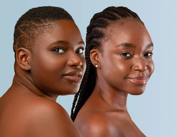 Half-naked beautiful chubby and skinny young dark-skinned black women posing on pastel studio background, looking at camera and smiling, closeup, collage for body positive concept