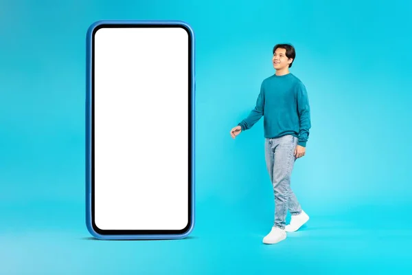 Asian Teen Boy Walking Huge Phone Blank Screen Posing Blue — 스톡 사진