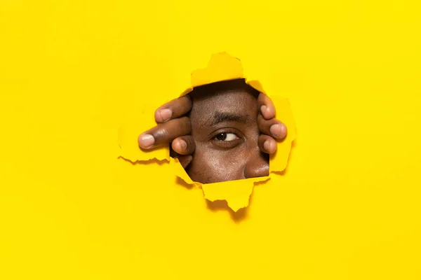 Watching You African American Man Looking Camera Hole Torn Yellow — Stock Photo, Image