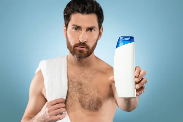 Cosmetics Product Ads Template Shirtless Bearded Man Holding Tube Shampoo — Stok Foto