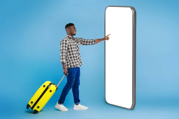 Handsome Millennial Black Guy Bright Suitcase Using Huge Phone White — Stock Photo, Image
