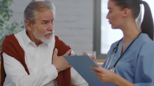 Clinic Senior Grey Haired Man Complaining Shoulder Muscles Pain Careful — Wideo stockowe