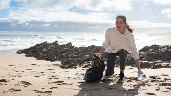 Earth Day Female Volunteer Polyethielene Bag Picking Plastic Bottle Beach — Zdjęcie stockowe