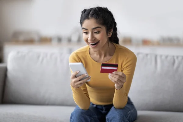Mobile Payments Excited Indian Woman Smartphone Credit Card Hands Sitting — Foto Stock