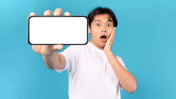Shocked Japanese Teen Boy Showing Smartphone Blank Screen Touching Face — 스톡 사진
