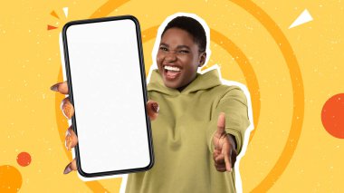 Online Offer. Joyful Oversized African American Woman Pointing Finger And Showing At Camera Cell Phone With White Blank Screen, Posing Standing Over Colorful Background, Mockup, Collage