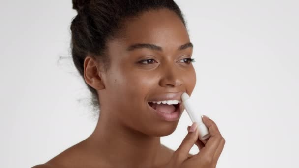 Lip Care Close Semi Profile Portrait Young African American Woman — стоковое видео