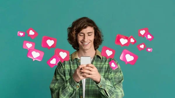 Glad Millennial Caucasian Male Student Has Romantic Chat Hearts Smartphone — Stock Photo, Image