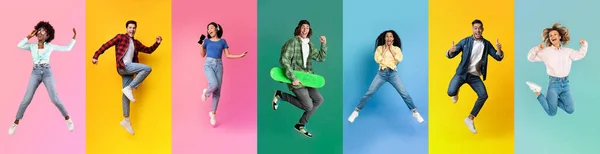 Diverse Young People Expressive Positive Emotions While Jumping Colorful Background — 스톡 사진