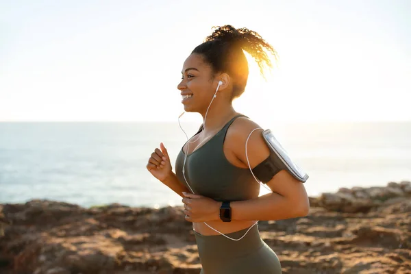 Happy Young African American Female Sports Wear Headphones Smartphone Running — Stock Photo, Image
