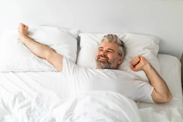 Happy Smiling Handsome Middle Aged Man Lying Bed Alone Stretching — Stock Photo, Image