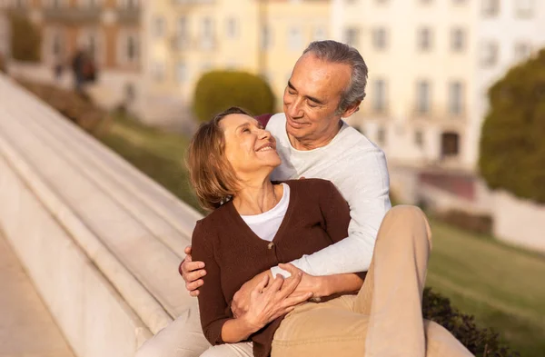 Happy Senior Couple Hugging Sitting Enjoying Weekend Outdoors Retired Spouses — Stock Photo, Image