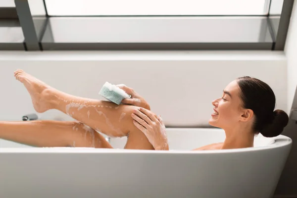 Side View Relaxed Female Taking Bath Washing Legs Sponge Applying — Stok Foto