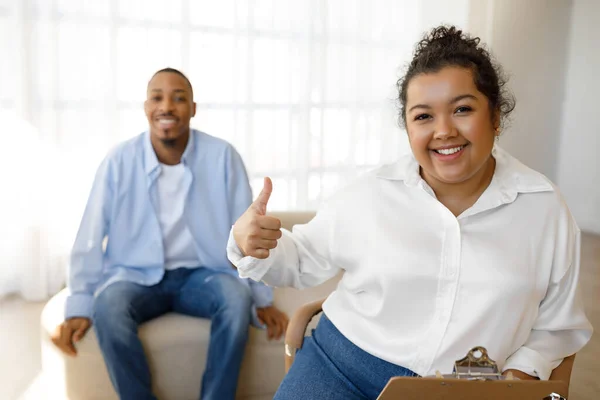 Hispanic Chubby Young Lady Therapist Showing Thumb Smiling Camera Have — Stock Photo, Image