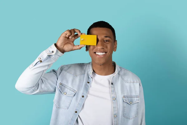Happy Funny Millennial Black Male Casual Puts Credit Card Eye — Stock Photo, Image