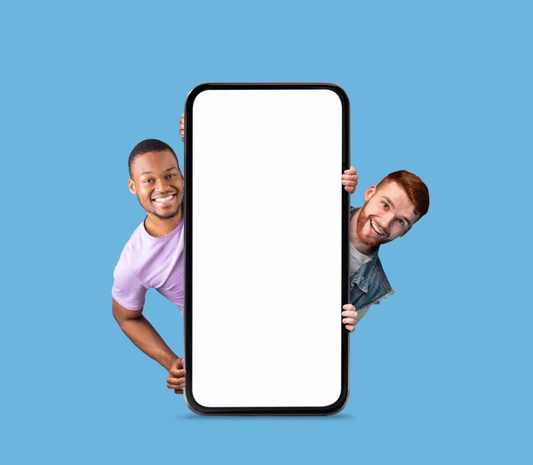 Mobile Two Cheerful Men Peeking Out Big Blank Smartphone White — Stock Photo, Image