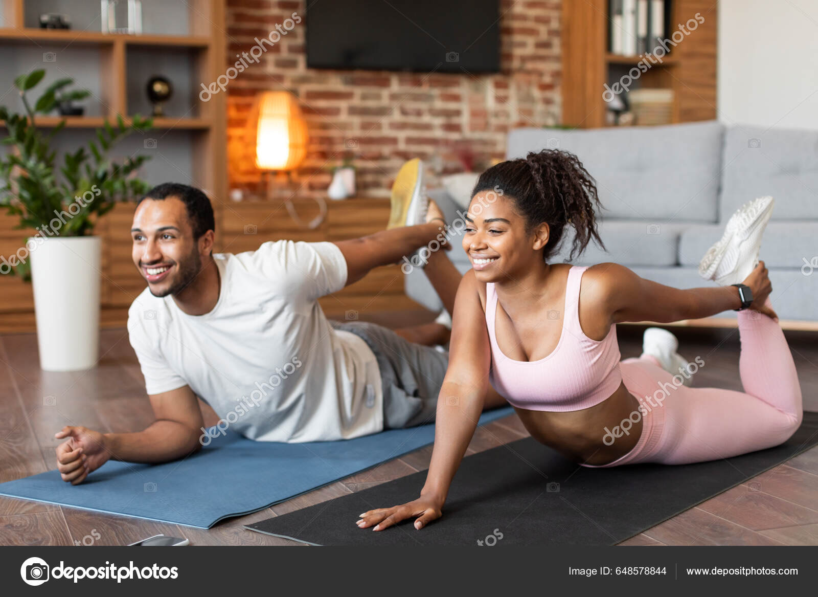 Cheerful Young Black Family Sportswear Doing Leg Stretching