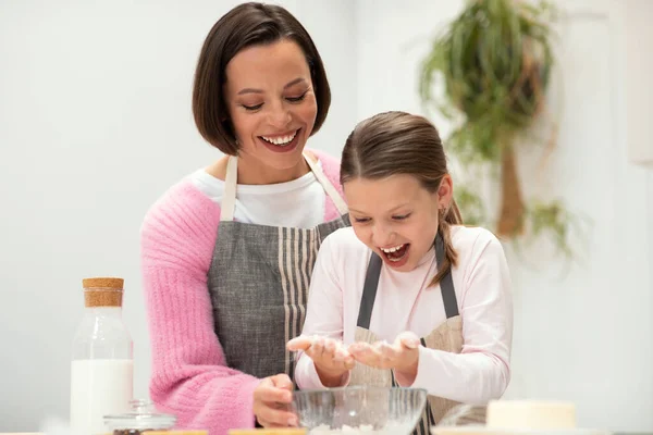 Satisfied Caucasian Young Mom Small Daughter Aprons Make Dough Cookies — Stock Photo, Image
