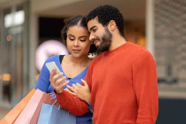 Diverse Couple Shopping Online Using Smartphone Together Choosing Purchasing Something — Stock Photo, Image
