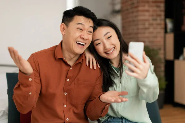 Excited Asian Couple Taking Selfie Smartphone Man Woman Communicating Video — Stock Photo, Image