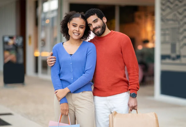 Consumerism Mixed Couple Doing Shopping Hugging Standing Modern Mall Posing — Stock Photo, Image