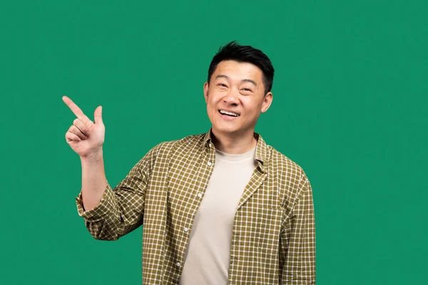 Excited Asian Middle Aged Man Pointing Finger Aside Free Space — Stock Photo, Image