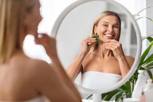 Beauty Skincare Concept Beautiful Middle Aged Woman Massaging Face Gua — Stock Photo, Image