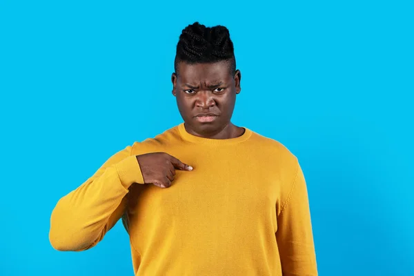 Portrait Of Confused Young African American Man Pointing At Himself, Frustrated Millennial African American Guy Having Doubts, Standing Isolated Over White Blue Studio Background, Copy Space