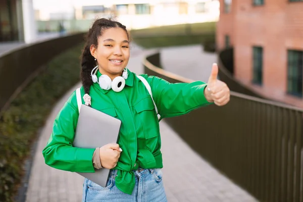 Happy Mixed Race Female Student Gesturing Thumbs Holding Books Posing — Stock Photo, Image
