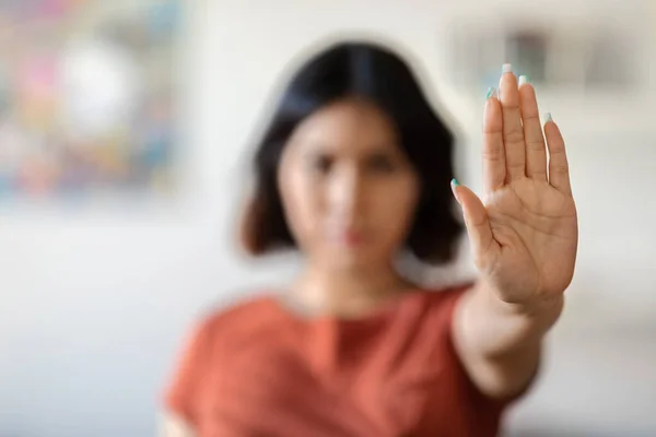 Stop Domestic Violence. Serious Young Woman Showing Open Palm Gesture At Camera, Middle Eastern Millennial Female Gesturing Sign Of Deny Or Refuse, Demonstrating Enough With Hand, Selective Focus