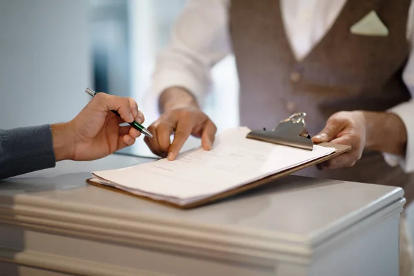Cropped Shot Man Signing Papers Checking Hotel Reception Indoors Male — Stock Photo, Image