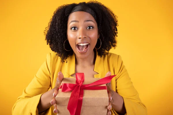 Excited Young African American Curly Lady Holding Box Gift Looking — Stock Photo, Image