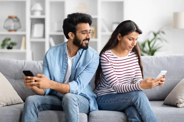 Young Indian Wife Using Mobile Phone Husband Watching Spying His — Stock Photo, Image
