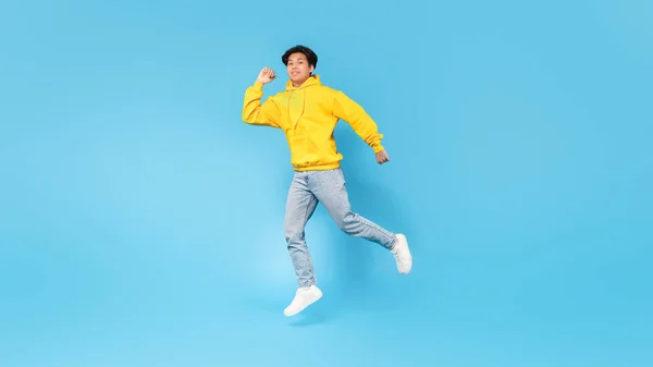 Positive Asian Teenager Boy Jumping Posing Having Fun Advertising Great — Stock Photo, Image