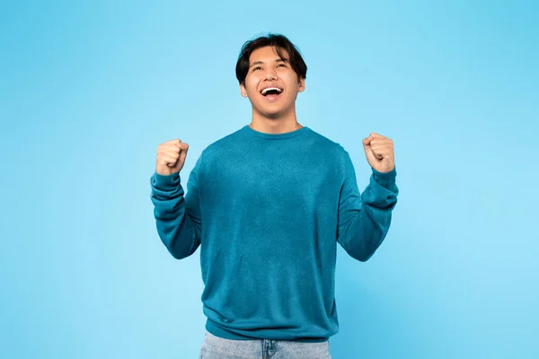 Joyful Asian Teen Boy Screting Shaking Fists Celebrating Success Standing — Fotografia de Stock