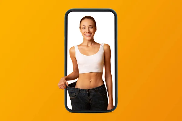 Smiling Young European Woman Sportswear Enjoy Weight Loss Result Smartphone — Stock Photo, Image
