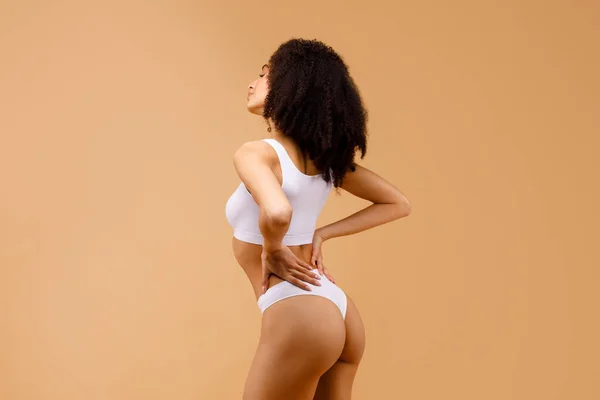 Profile side view of slim lady with perfect body shape posing over