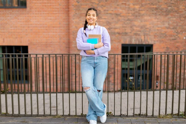 Cheerful Mixed Race Student Girl Hugging Books Posing College Building — Stock Photo, Image