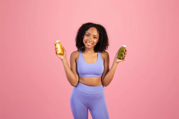 Positive Millennial African American Lady Sportswear Hold Jars Juice Smoothies — Stock Photo, Image