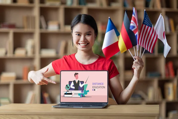 Happy Young Asian Lady Student Many International Flags Show Finger — Stock Photo, Image