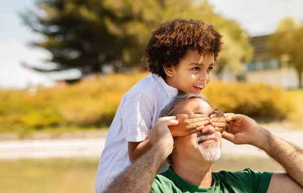 Cheerful Old Caucasian Grandfather Holds Small Mixed Race Boy His — Stock Photo, Image
