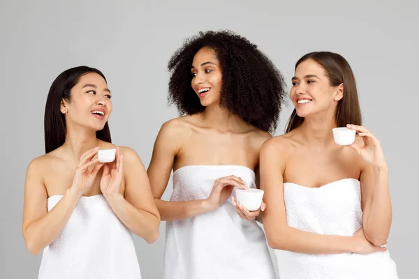 Three Young Diverse Women Holding Cosmetic Natural Face Cream Jars — Stock Photo, Image