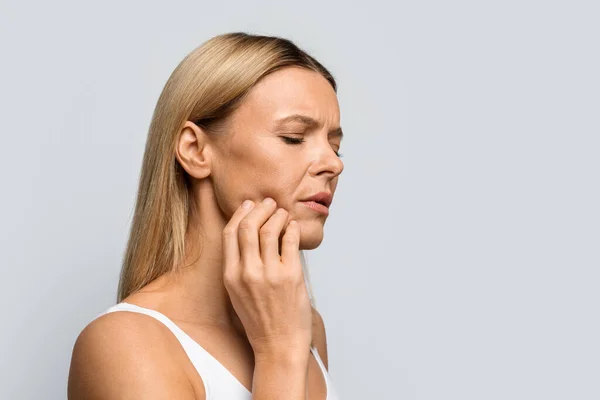 Middle Aged Blonde Woman Pain Touching Her Cheek Unhappy Lady — Stock Photo, Image