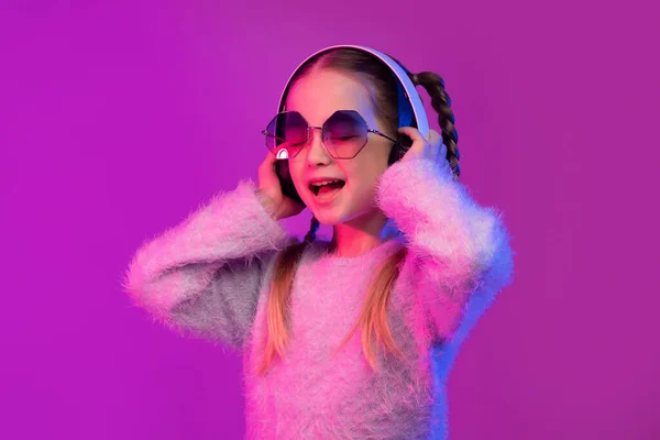 Joyful Happy Cute Little Girl Schooler Using Modern Wireless Stereo — Stock Photo, Image