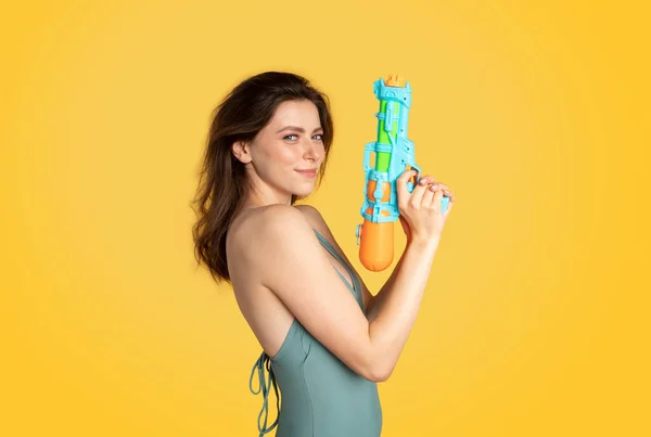 Playful Young Woman Swimsuit Holding Water Gun Looking Camera Having — Stock Photo, Image