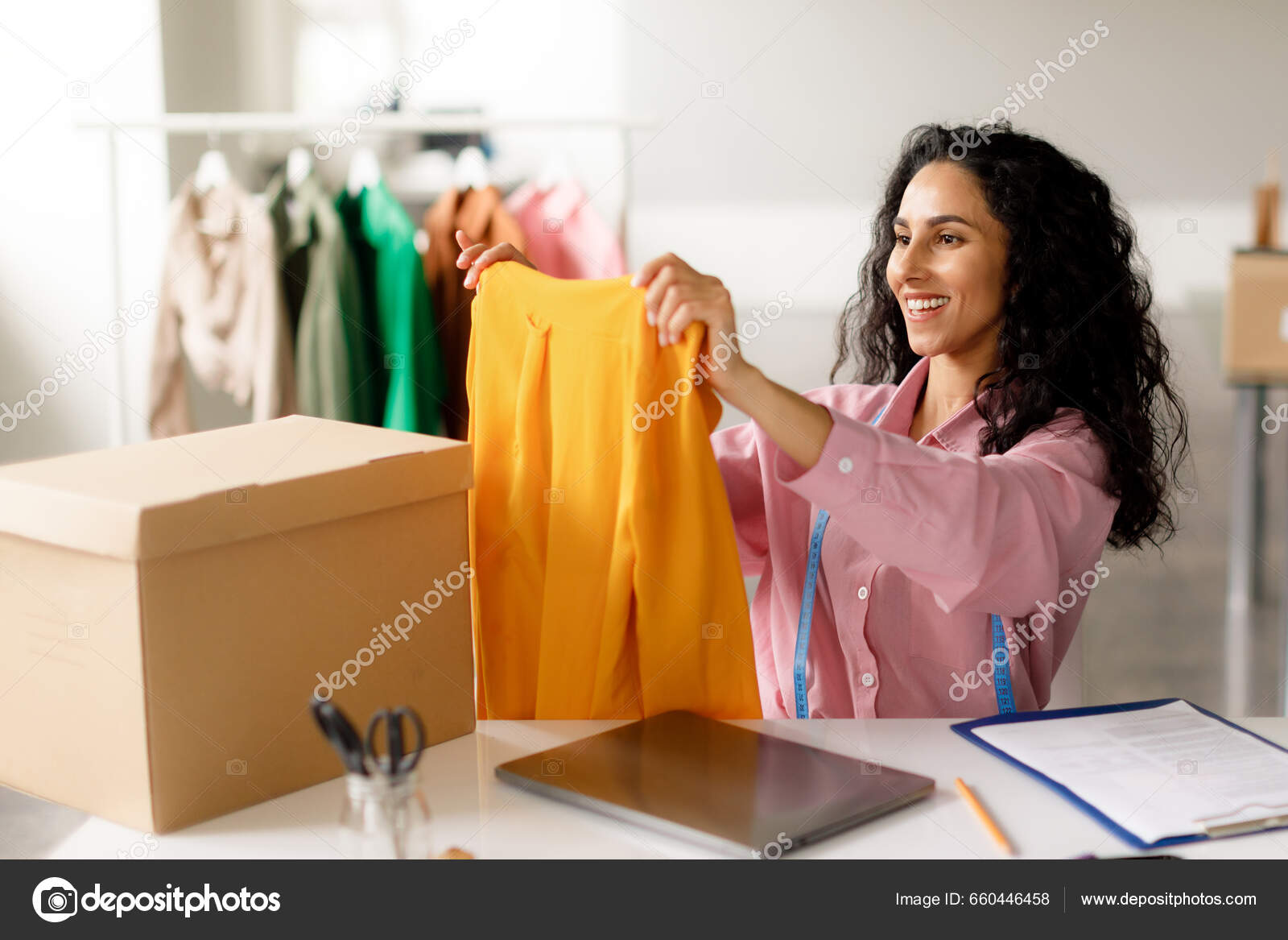 Clothing Design Business Successful Designer Lady Holding Trendy Garment  Packing Stock Photo by ©Milkos 660446458